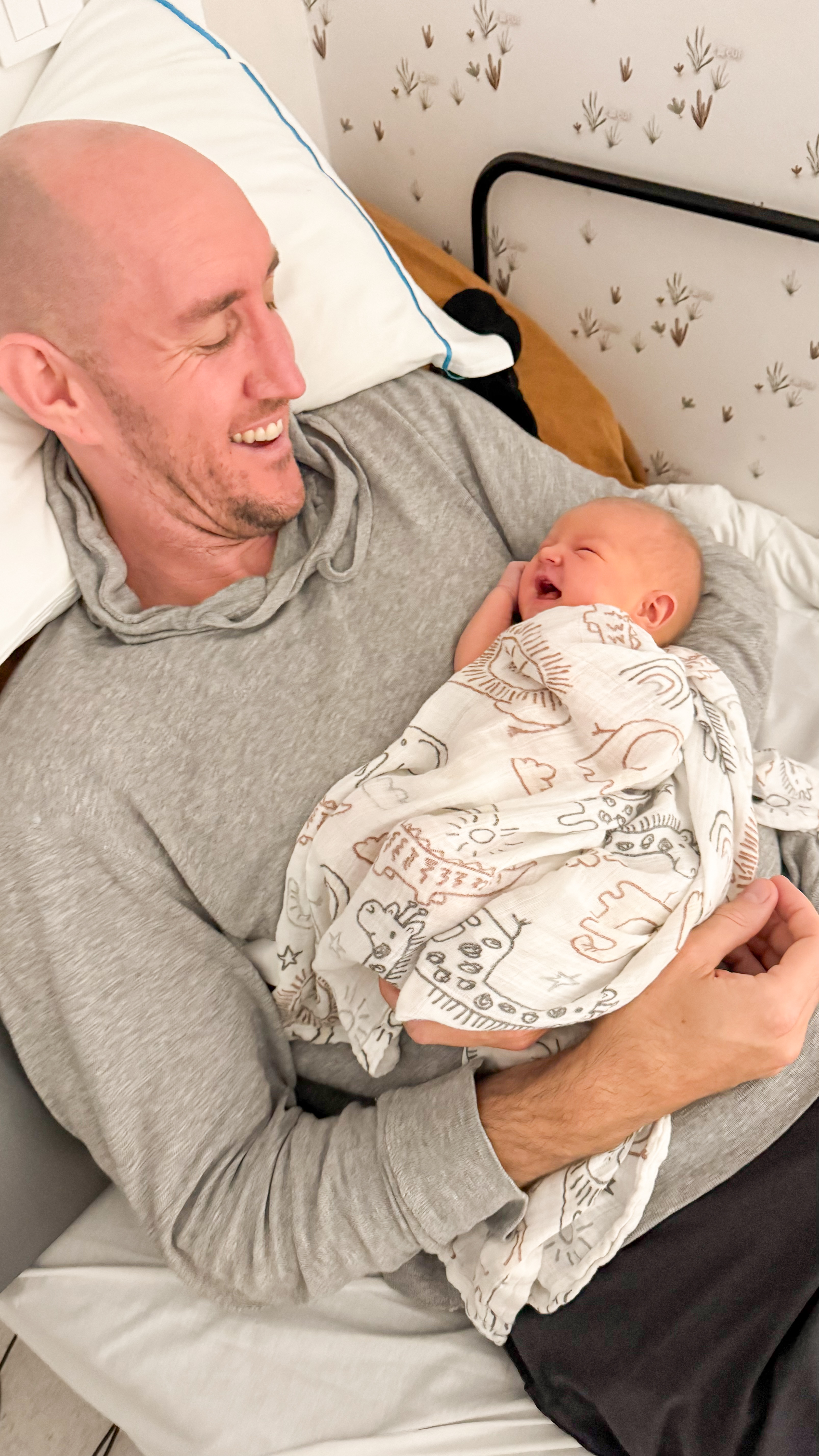 Jason holding baby Leon for the first time